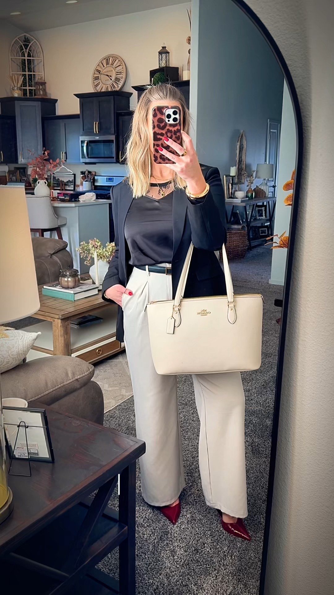 Right on the edge of business professional with a structured blazer, a silk blouse, and a pop of color with a red kitten heel. #businessprofessional #officeoutfit #corporatestyle

#LTKWorkwear #LTKMidsize #LTKStyleTip