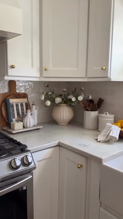 Simple kitchen styling that makes such a difference. 🤎✨

I love how a few thoughtful pieces can instantly make a countertop feel warmer, more inviting, and pulled together without sacrificing functionality.

Mixing natural textures with everyday essentials and a few decorative touches is such an easy way to create that effortless, lived-in look. 🌿

Sometimes it really is the little details that make a kitchen feel like home.

#LTKHome #LTKSeasonal #LTKmomlife