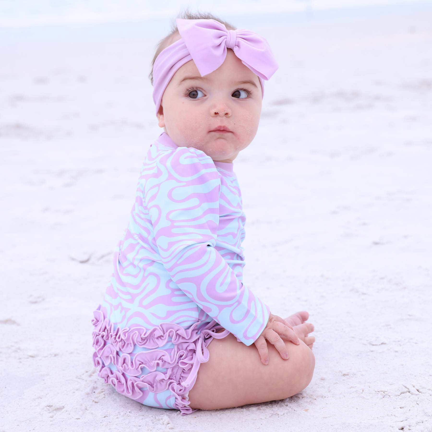 Long Sleeve Rash Guard With Ruffle Bottom | Wavy Days | Caden Lane