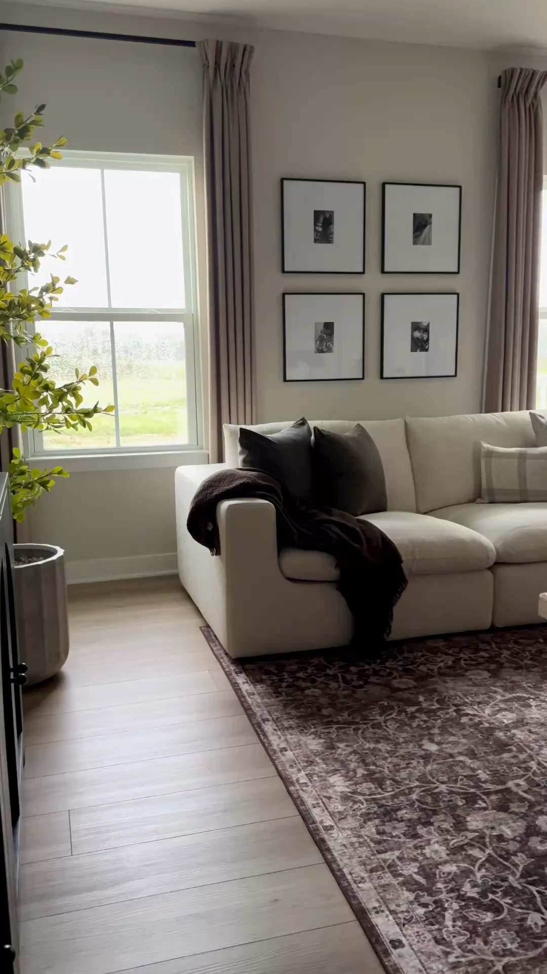 Cream soda, linen sofa, white sofa, brown rug, floral rug, neutral rug, living room styling, gallery frames, faux tree, shady lady tree, throw blanket, neutral pillow covers, faux concrete planter, wood coffee table, coffee table, elm coffee table

#LTKSeasonal #LTKHome #LTKU