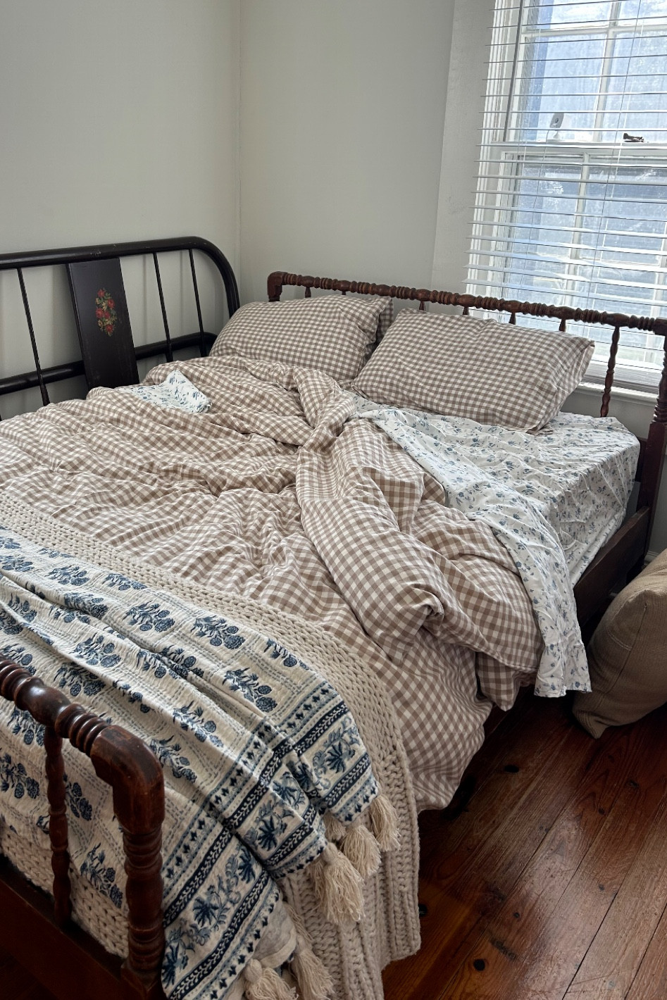 The bed frame was thrifted, but it is a Jenny Lind Spindle Style bed! The blue flower throw blanket is also from Kirklands, but I attached a similar one from amazon below! 