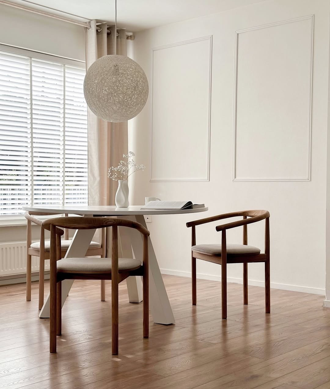 Soft morning light, warm wood tones, and minimal details — this is what calm feels like. Sharing a cozy corner of our home that’s become my favorite spot for slow mornings, coffee breaks, and pages of inspiration. The curved-back chairs paired with the sleek round table create a harmonious balance between function and style. I love how the neutral palette lets the natural textures shine through. Whether it’s quiet journaling or a mindful meal, this space holds simple joys. Everything here blends modern minimalism with a timeless aesthetic that just feels like home. You can shop the look and recreate this cozy corner via my LTK ✨ #NeutralDecor #MinimalStyle #ScandiVibes #HomeGoals #CozyCorner #InteriorInspo #DiningSpace #WarmMinimalism #WoodDetails #HomeStyle #DecorLover

#LTKHome #LTKActive #LTKSeasonal