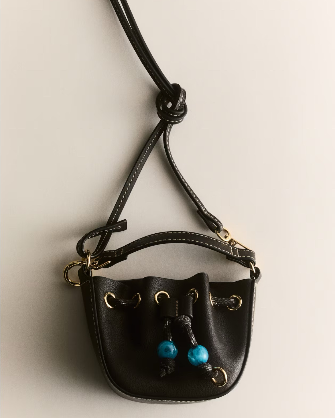 Turquoise bead detail black crossbody bag

#LTKSeasonal