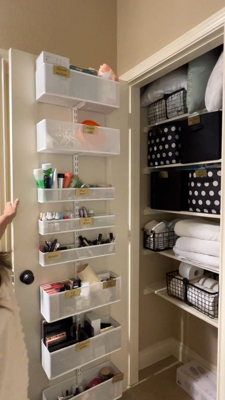 Organized linen closet with space for your makeup and skincare on the door. 

#LTKhome #LTKfindsunder50 #LTKVideo