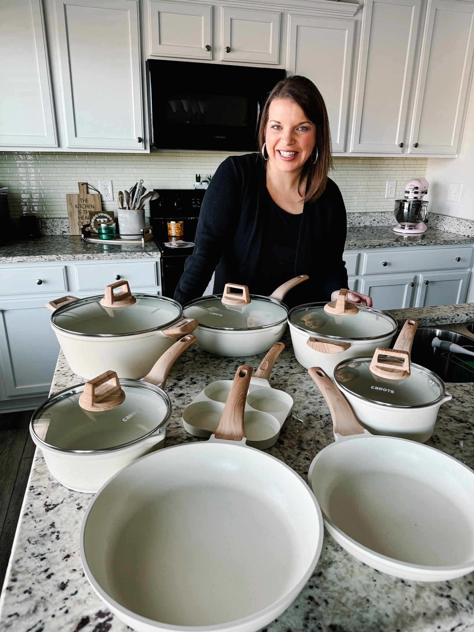 We’ve been in need of new pots and pans for quite some time. If you can believe it, we were still using the same set we bought when we first got married. And we celebrate 13 years in March! I found this 21 piece set on Amazon after looking for a while and instantly fell in love. Plus the 17,000 4.6 ⭐️ reviews helped!
Besides being beautiful the set is great quality and not heavy at all. The handles look like wood but are actually rubber. The pots and pans are white granite nonstick and I certainly found the nonstick to be true! Zero rice was stuck to the bottom. And they are extremely easy to clean - everything just wiped off! Comes in white, black or gray. I chose the white only because I wanted all of the pieces that came with the set. The black and grey come in smaller sets.

#LTKhome #LTKsalealert