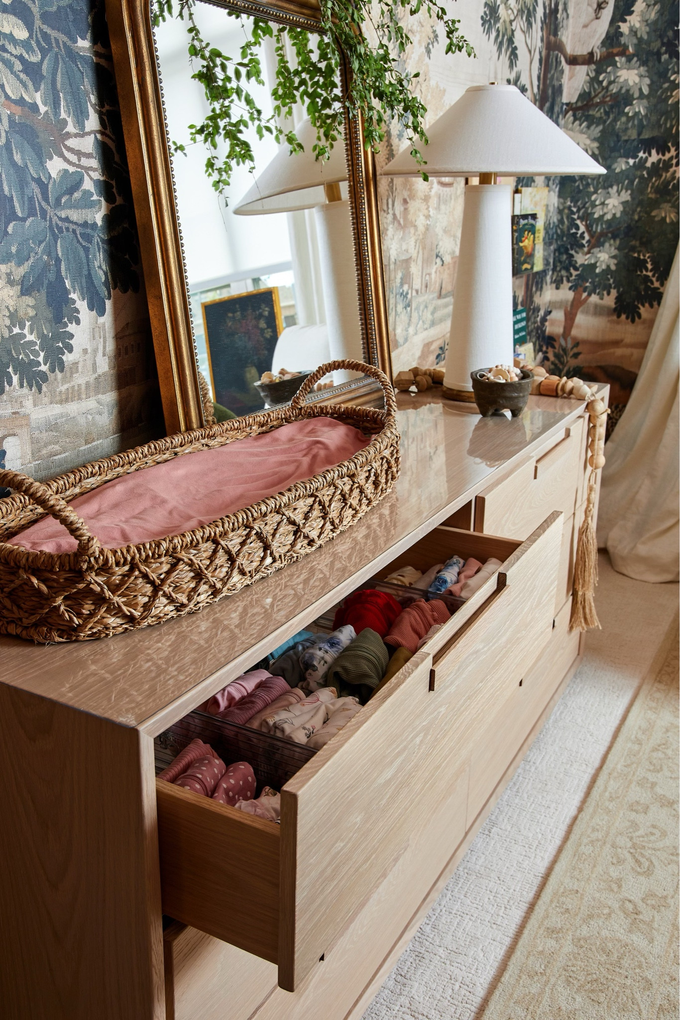 Baby girl nursery with the best dresser, drawer organizers, gold mirror, her beautiful mural, acrylic bookshelves, changing table basket and more! I’m still in awe at how her nursery turned out and I absolutely adore it. So far everything has worked out perfectly for baby girl  

#LTKhome #LTKstyletip #LTKbaby