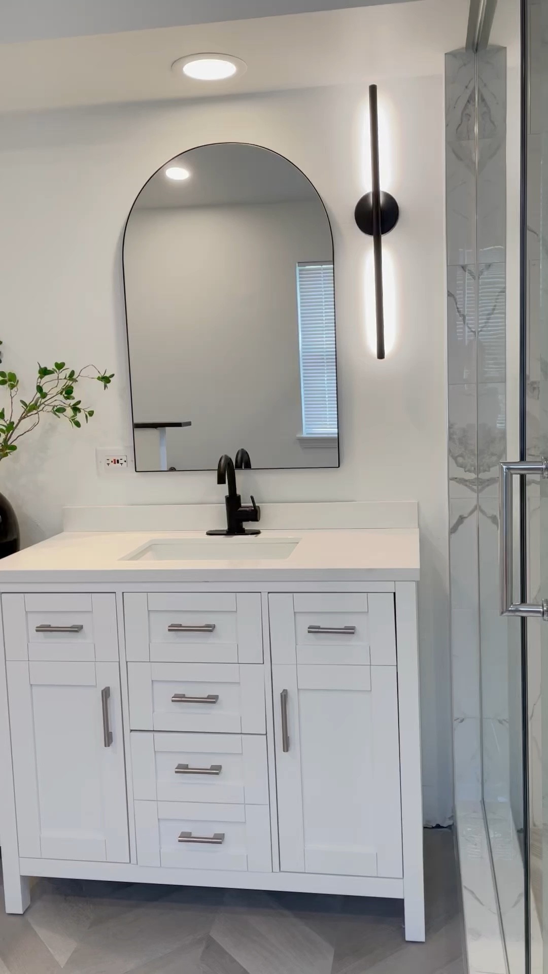 Modern Bathroom 
Arch Mirror
Vanity 
Modern Light Sconce 

#LTKhome #LTKstyletip