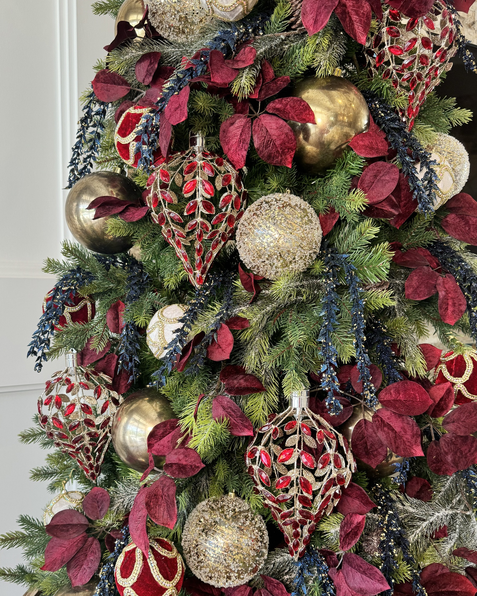 This is some of the most beautiful decor from @sullivanshomedecor . 

The LED Teardrop ornaments were the inspiration for the tree.  They are crafted so beautifully and they have a light that can turned on by simply twisting the top.  

Typically I use ribbon in my trees but when I saw these beautiful red leafed sprays, I knew I didn’t need ribbon. 

Tip! These sprays are very long. The trick to using them throughout the tree is to cut the branches off. Then one stem turns into 6 picks for the tree. 

Lastly the red and white velvet ornaments are covered in bling and perfectly fit the essence of the tree. 

#redandgoldchristmas #elegantchristmas #christmastreedevor #christmasdecor
#LTKVideo 

#LTKSeasonal #LTKHome