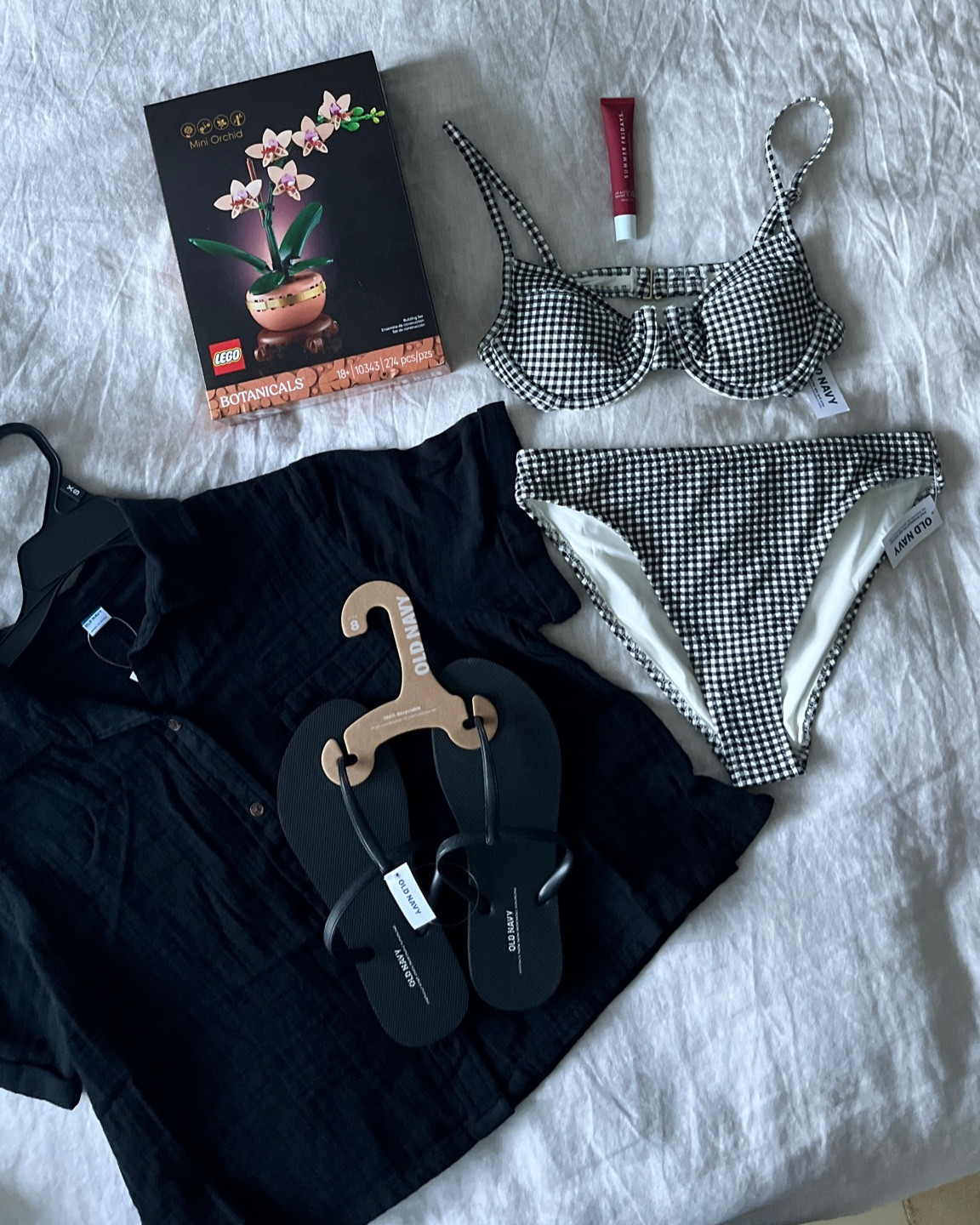 Bikini - gingham - summer Fridays lip balm - legos mini orchids - sandals - flip flops - old navy finds - vegan lip balm

#LTKSeasonal #LTKFindsUnder50