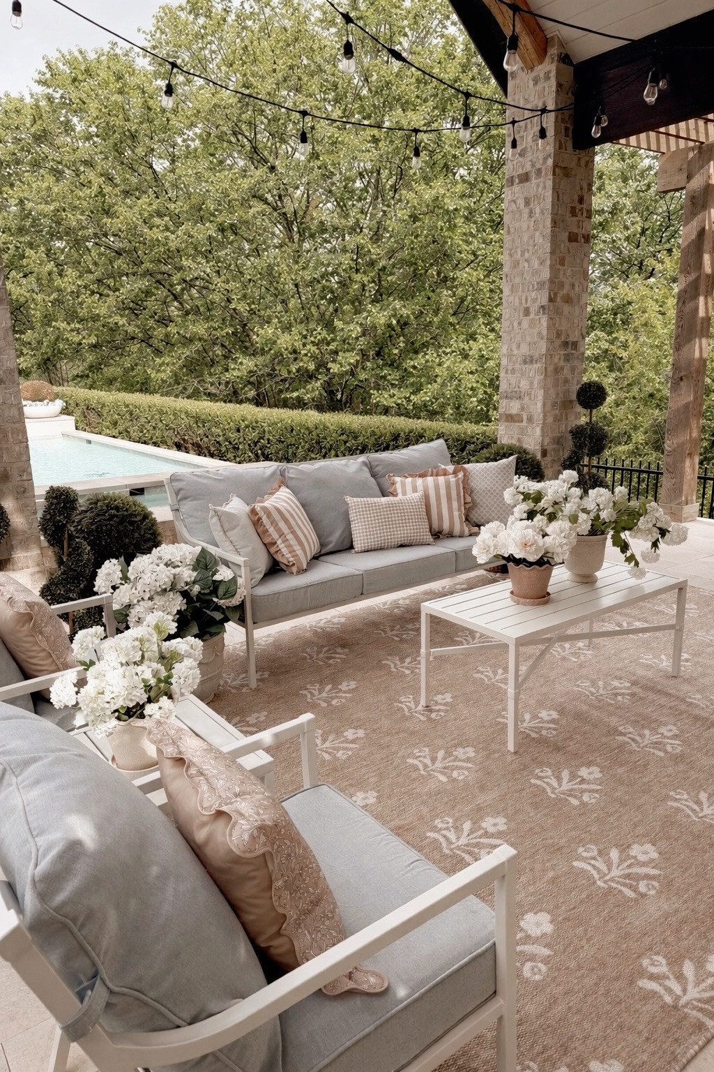 Our Cambria collection patio furniture in blue and white is *everything*! Especially love it paired with our Isla outdoor rug, our outdoor pillows and some of our viral planters!!  

 #LTKSeasonal #LTKHome