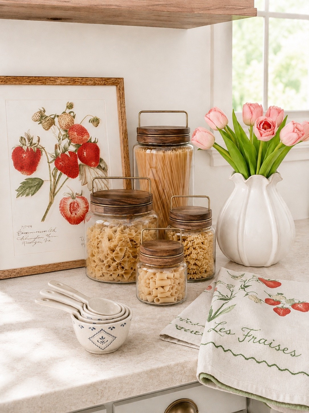 Fresh Magnolia Kitchen Finds for a Cozy Cottage-Inspired Kitchen

Soft florals, warm wood tones, and charming strawberry accents are making this little kitchen corner feel extra sweet for spring 🍓 I’m loving the mix of practical storage with pretty decorative touches that instantly warm up a countertop.

#magnoliakitchen #kitchenfinds #springkitchen #countertopdecor #amazonhomefinds

magnolia kitchen decor | strawberry kitchen accents | glass pasta jars | cottage style kitchen | spring kitchen decor | tulip arrangement | neutral kitchen styling | countertop organization | wood lid canisters | measuring cups | cozy kitchen finds | amazon kitchen finds | cottagecore kitchen | floral kitchen decor | decorative kitchen accessories | spring countertop styling | white ceramic vase | pasta storage jars | kitchen shelf styling | warm neutral kitchen | strawberry artwork | charming kitchen decor | curated kitchen finds | spring home refresh | kitchen inspiration

#LTKSeasonal #LTKHome