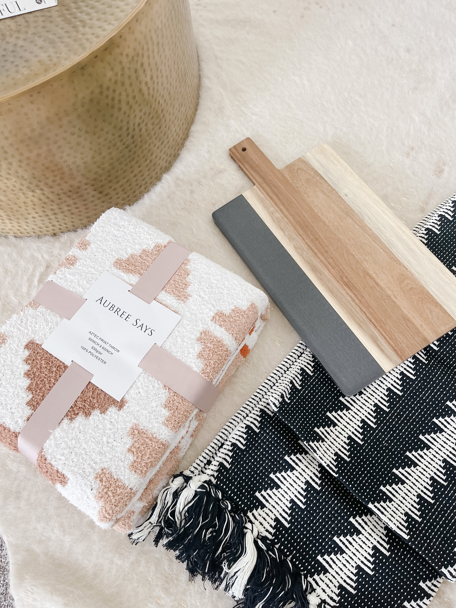 Cowhide decor, Aztec Throw,  camel, And black decor, also cute black and wood charcuterie board and table runner in black and white. These are from the Aubree Says line, but also some cute decor to go with this look! Pottery Barn black throw pillows- leather sued basket weave pillow cover.
Edgy Modern decor in tan and black. Target decor in black and tan.  
Gold drum coffee table from target. Studio Mc Gee at Target decor!

#LTKstyletip