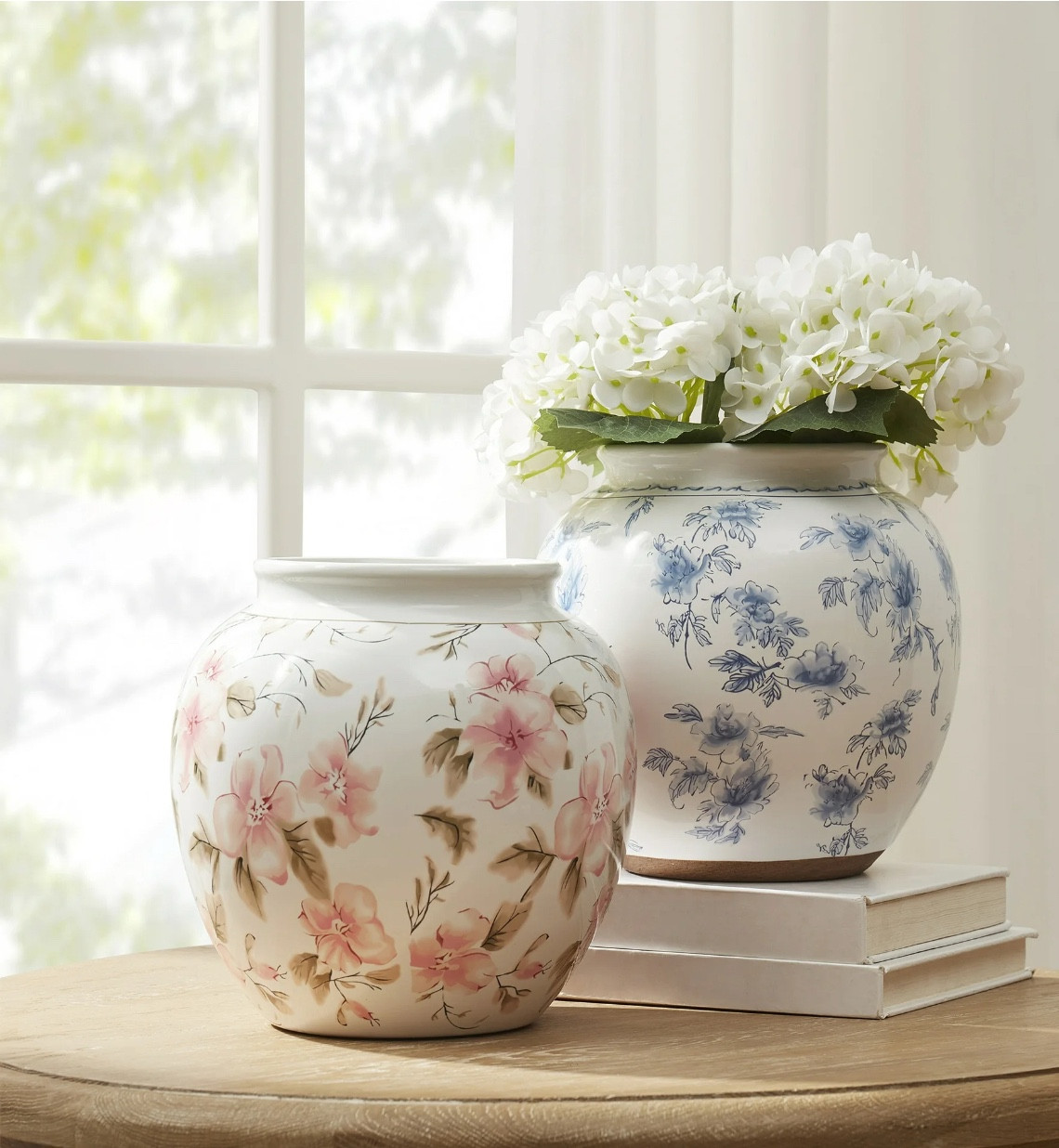 Add botanical beauty to your home décor with the My Texas House 8" Pink Floral Round Ceramic Vase. This decorative vase is handcrafted from high-quality, durable ceramic and showcases artful floral designs with timeless appeal. Its classic round shape and sturdy base ensure stability, preventing accidental tipping, while its versatile design makes it easy to incorporate into any existing décor. Use this vase to display your favorite flowers or greenery on your tabletop, mantel, windowsill, shelf, console table, and more. Created by home decor blogger and influencer Erin Vogelpohl, My Texas House décor reflects Erin's signature modern farmhouse and fresh country style.

#LTKHome #LTKSeasonal #LTKStyleTip