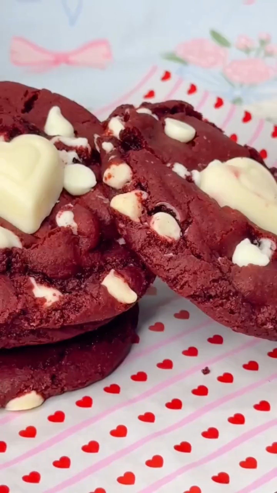 If you’re love red velvet and white chocolate these cookies are perfect for you! They’re so soft but perfectly sweet💕
.
Recipe at the end for you to screenshot!💌
.
Ingredients:
*  ½ cup of melted unsalted butter
*  ¾ cup of packed brown sugar
*  ¼ cup of granulated sugar
*  1 large egg
*  2 teaspoons of vanilla extract
*  1 2/3 cups of all-purpose flour
*  ¼ cup of cocoa powder
*  1 teaspoon of baking soda
*  ¼ teaspoon of salt
*  1 tablespoon of whole milk
*  ¼ tablespoon of apple cider vinegar
*  1 teaspoon of red gel food coloring
*  1 cup of white chocolate chips
Instructions:
1.  Preheat the oven to 350°F (180 °C). Line two cookie sheets with parchment paper or grease them with cooking spray. Set aside.
2.  In a large bowl, using an electric handheld mixer, beat together the butter, brown sugar, and granulated sugar until well incorporated, light and fluffy-about 3 minutes.
3.  Beat the vanilla extract and egg into the butter mixture until well incorporated.
4.  Sift the flour, cocoa powder, baking soda, and salt, and mix until well incorporated.
5.  Add the red food coloring and mix until all the dough has been evenly dyed red.
6.  Lastly, add the white chocolate chips and mix on low until well incorporated.
7.  Cover the bowl with cling wrap and refrigerate for 2-3 hours.
8.  Thaw out the dough for 15 minutes, so it’s easier to scoop.
9.  Using a cookie scoop or large tablespoon, form the dough into balls of about 1 to 2 tablespoons. Roll each ball in your hand to form a sphere shape.
10.  Place each completed cookie dough ball on the baking sheet, about two inches between each. About six per tray.
11.  Bake for 10-12 minutes or until just golden brown
12.  Remove from the oven and cool fully on the cookie tray.
13.  Enjoy!
.
#redvelevet #redvelevetcookies #cookierecipe #baking #recipe
