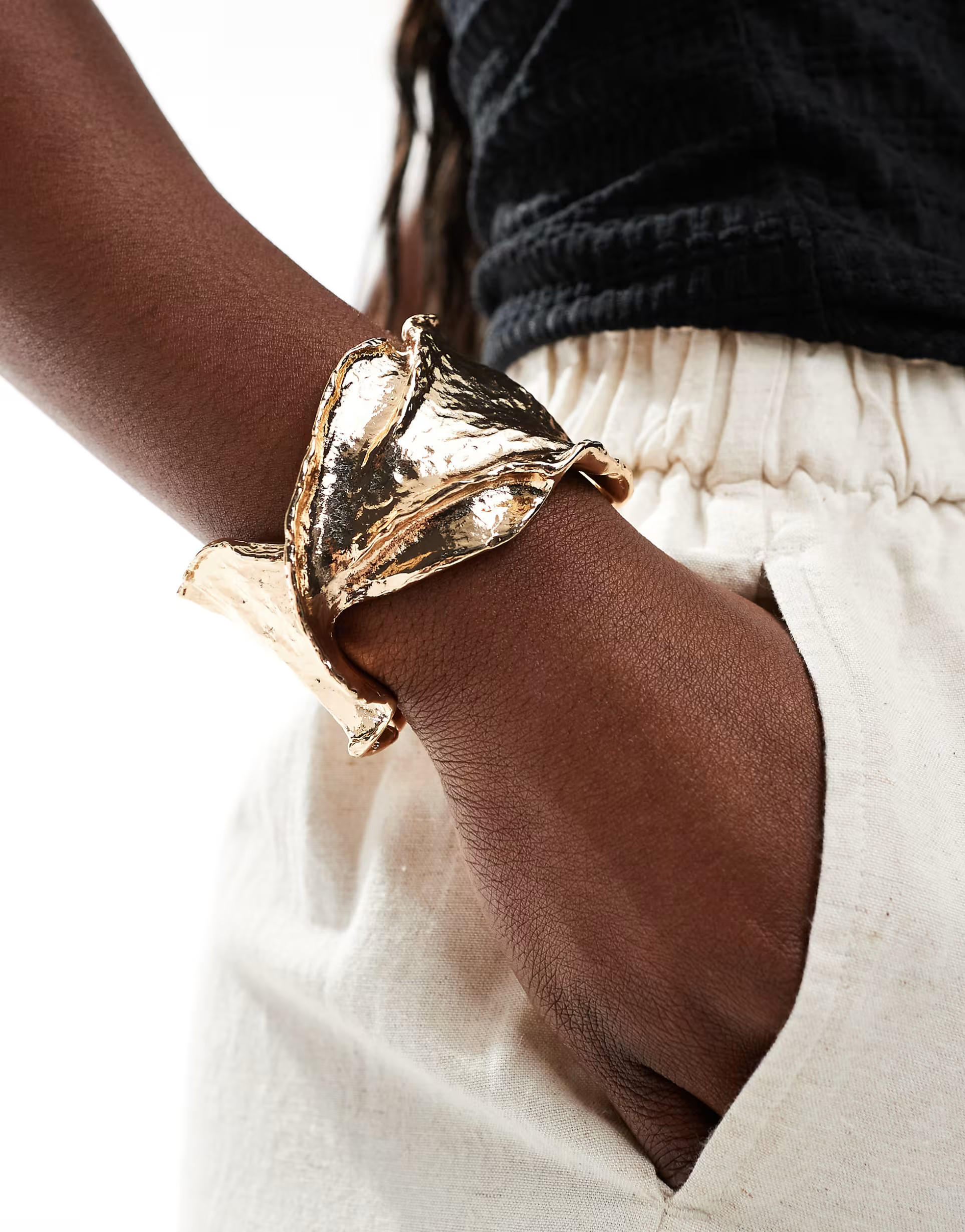ASOS DESIGN cuff bracelet with twist molten detail in gold tone | ASOS | ASOS (Global)