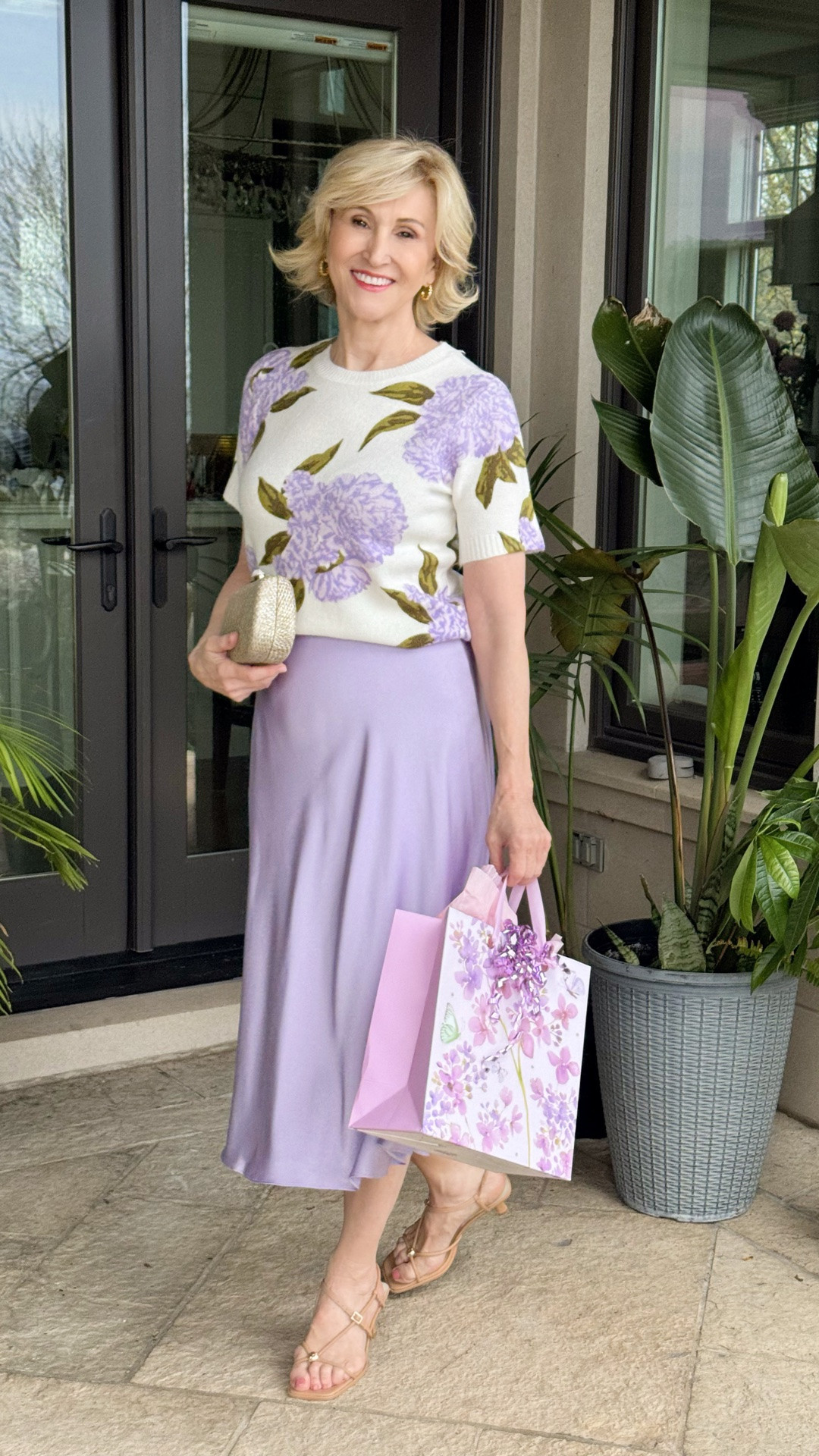 There’s something about soft lilac tones that feels instantly elegant and uplifting… especially when paired with a silky skirt that skims instead of clings. And honestly? That’s one of the biggest style shifts many of us make after 50 — we still want to feel feminine and polished, but we’re no longer interested in squeezing into stiff, uncomfortable clothes just to look “put together.”

I love how this outfit feels dressy without trying too hard. The floral knit adds softness near the face, while the fluid skirt creates beautiful movement and quietly flatters the tummy and hips (always a win in my book!).

#LTKootd #LTKOver40 #LTKSeasonal