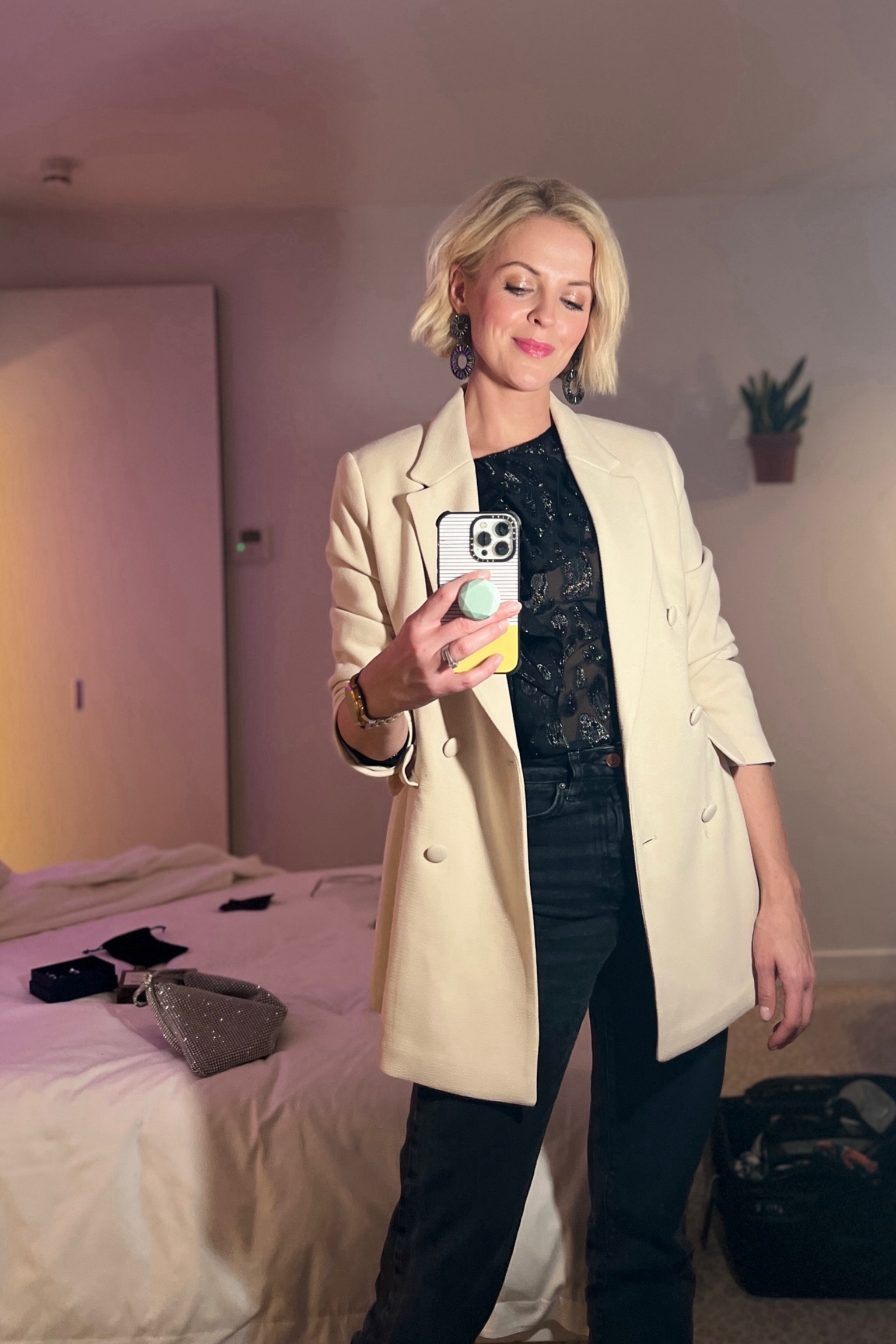 Easy evening out jeans outfit. Straight leg black jeans, heels, sheer blouse and blazer. Has some sparkle with earrings and a bag. Party ready!

#LTKstyletip #LTKSeasonal #LTKparties