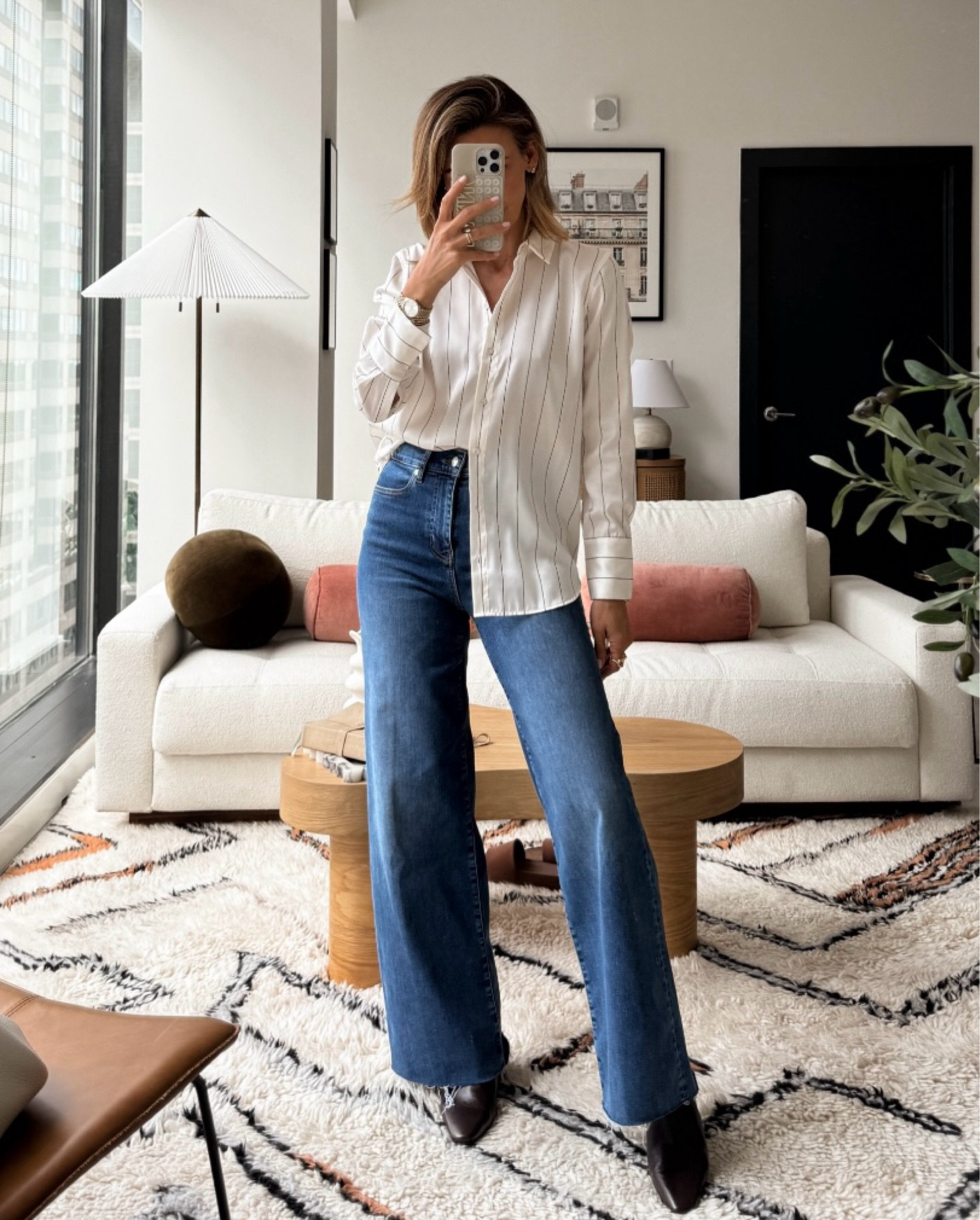 Consider this your go-to fall outfit for any and every occasion. These wide leg jeans offer a comfy fit and a streamlined silhouette, and they pair perfectly with a button up top. Slip into some ankle booties to finish off the look — or opt for ballet flats, heels, or even sneakers. I’m wearing a size 26 in the jeans and an XS in the blouse.

#LTKFindsUnder100 #LTKStyleTip #LTKSeasonal