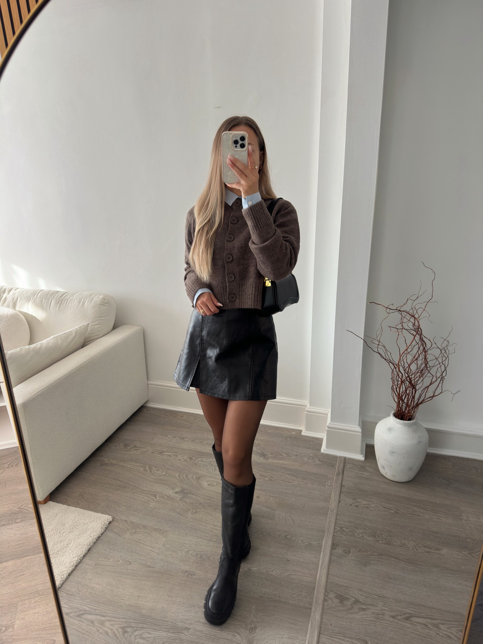 Chic autumn uniform: black + brown, knit, mini skort, and knee-high boots#LTKFashionMonth

#LTKautumn #LTKwinter