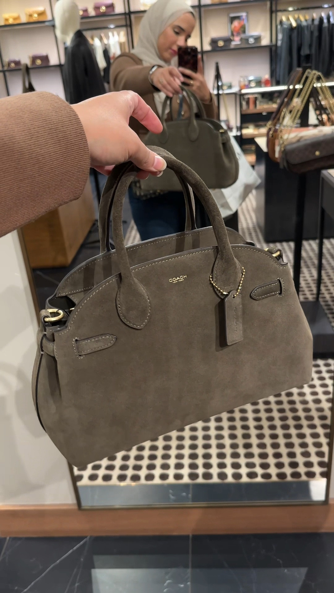 the empire caryall 28 khaki suede handbag for this autumn 🍂 how gorgeous is this bag from Coach, the perfect mid range luxury brand! Slowly starting to buy bigger bags bs my usual mini crossbody bags

#comeshopwithme #coachbag #autumnstyle #designerbags 

#LTKautumn #LTKFashionMonth #LTKluxury