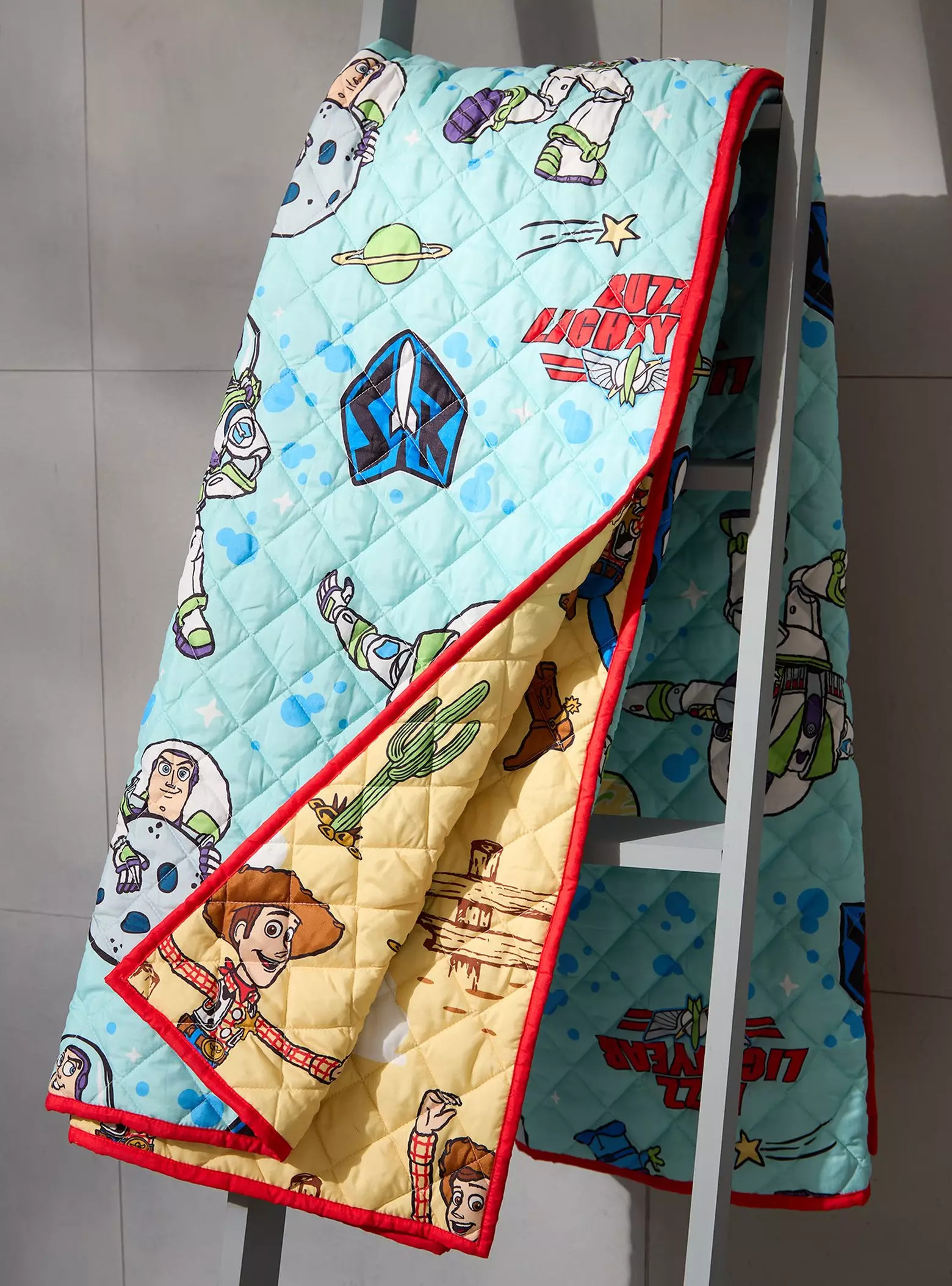 Disney Pixar Toy Story Buzz & Woody Reversible Retro Quilt - BoxLunch Exclusive | BoxLunch | BoxLunch