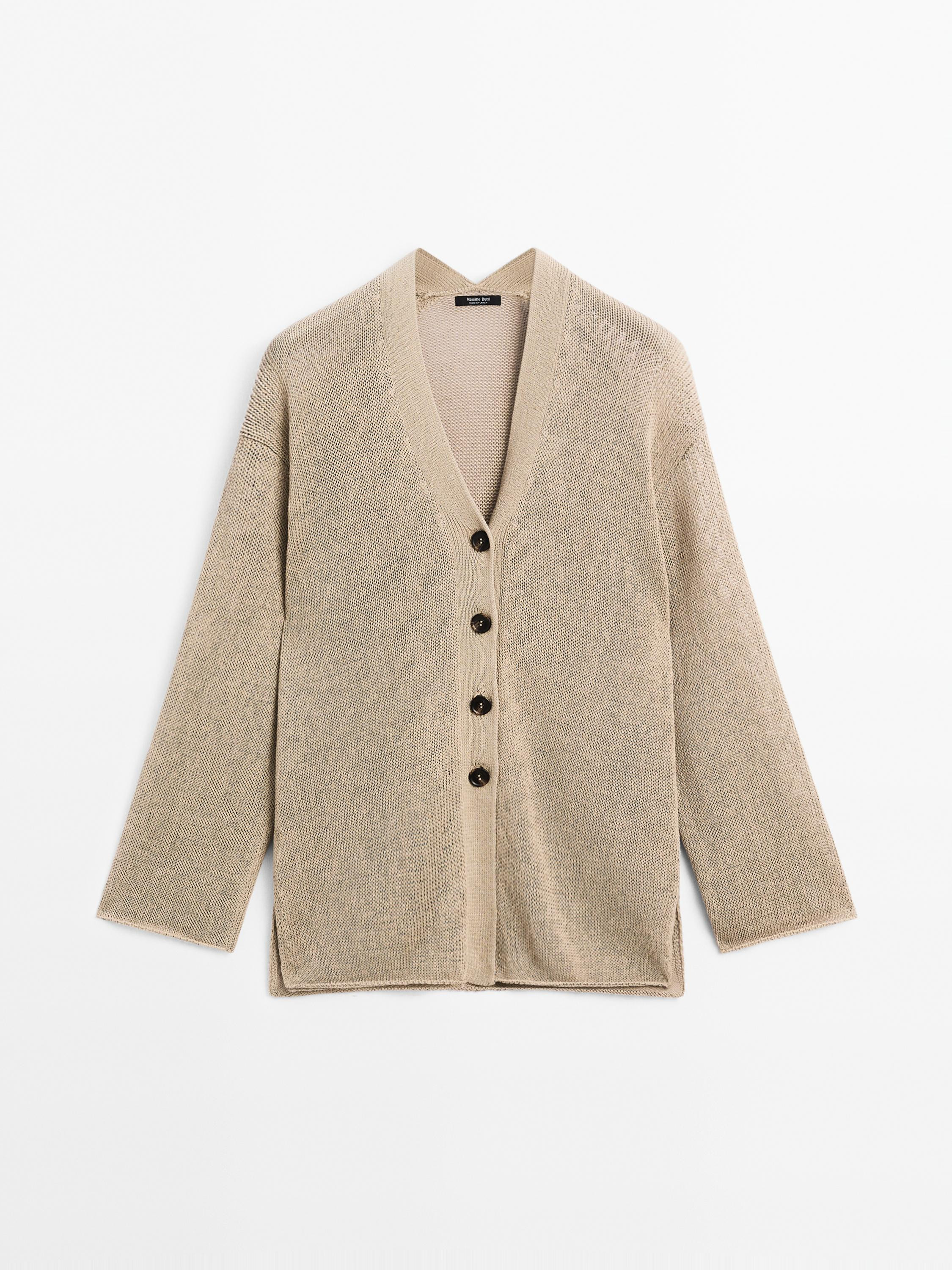 Knit cardigan made of a cotton blend. V-neck . Long sleeves. Button-up front with mother-of-pearl... | Massimo Dutti UK
