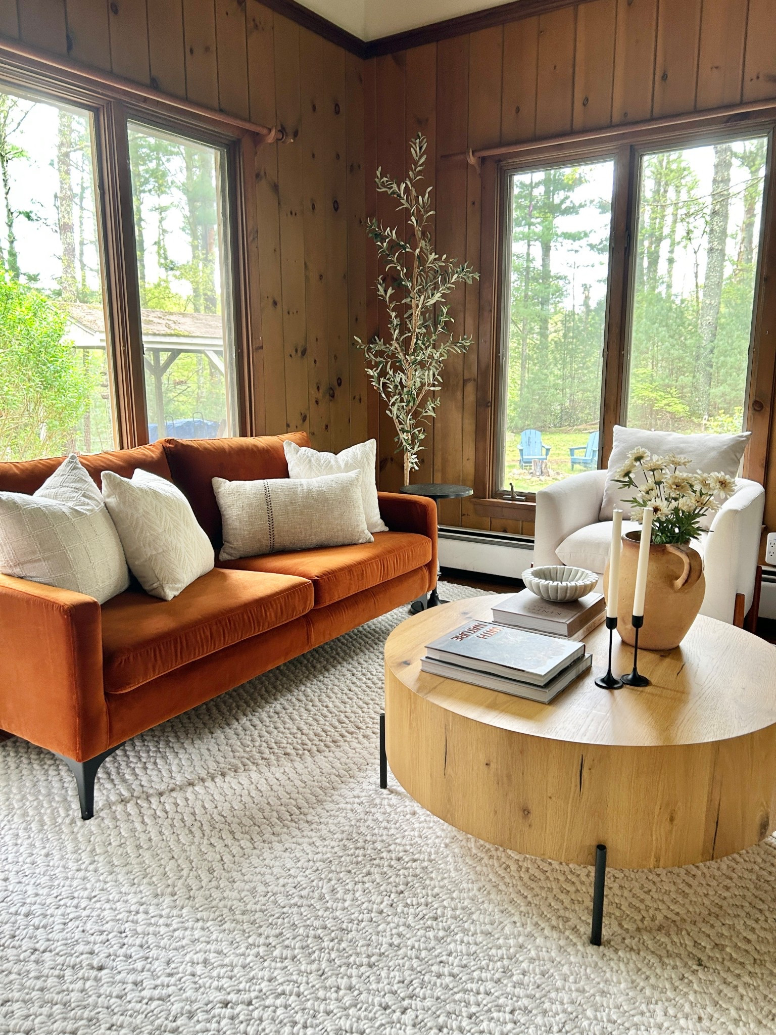 Beautiful wooded retreat with rust velvet sofa and round wood coffee table.

#livingroom

#LTKHome