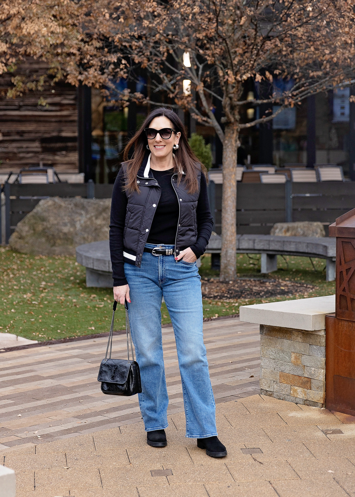 Sporty but  polished 🖤 Loving this varsity-style vest with classic blue jeans and sneakers.

#OnLTK 

#LTKMidsize #LTKOver40