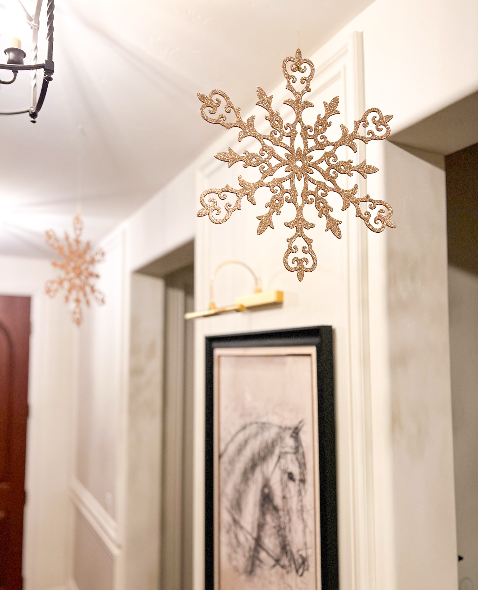 A fun and inexpensive way to decorate for Christmas. ❄️ We hung these gold snowflakes in our entryway. They are only $2.98 each! 

#LTKSeasonal #LTKHoliday #LTKHome