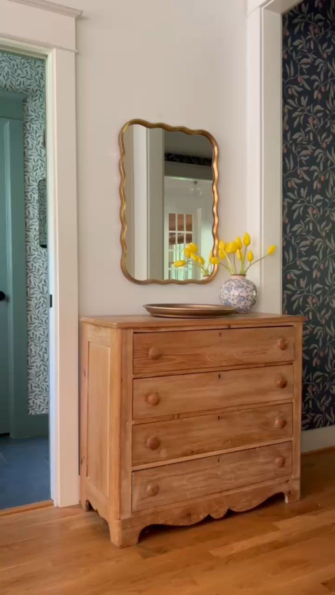 Love this nook in our entryway, featuring a vintage chest, darling wallpaper, and wavy mirror!

#LTKHome #LTKFindsUnder50 #LTKFindsUnder100