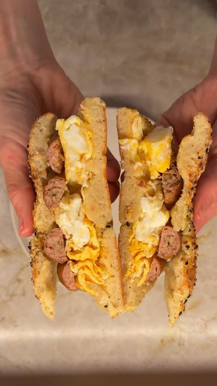 GLUTEN FREE BAGELS
1 cup gluten free all purpose flour 
2 teaspoons of baking powder 
1/4 teaspoon salt
1 cup plain Greek yogurt
1 egg yolk 
Everything seasoning

Combine all purpose flour, baking powder & salt. Add in Greek yogurt until it’s a dough (still slightly crumbly!) 
Split into two sections and make into a log then into a bagel shape 
Combine egg yolk & a little water to make egg wash then brush on top & center of bagel (makes it golden and crispy)
Cook in air fryer on 350 for about 10 min! 

Add scrambled egg & sausage!