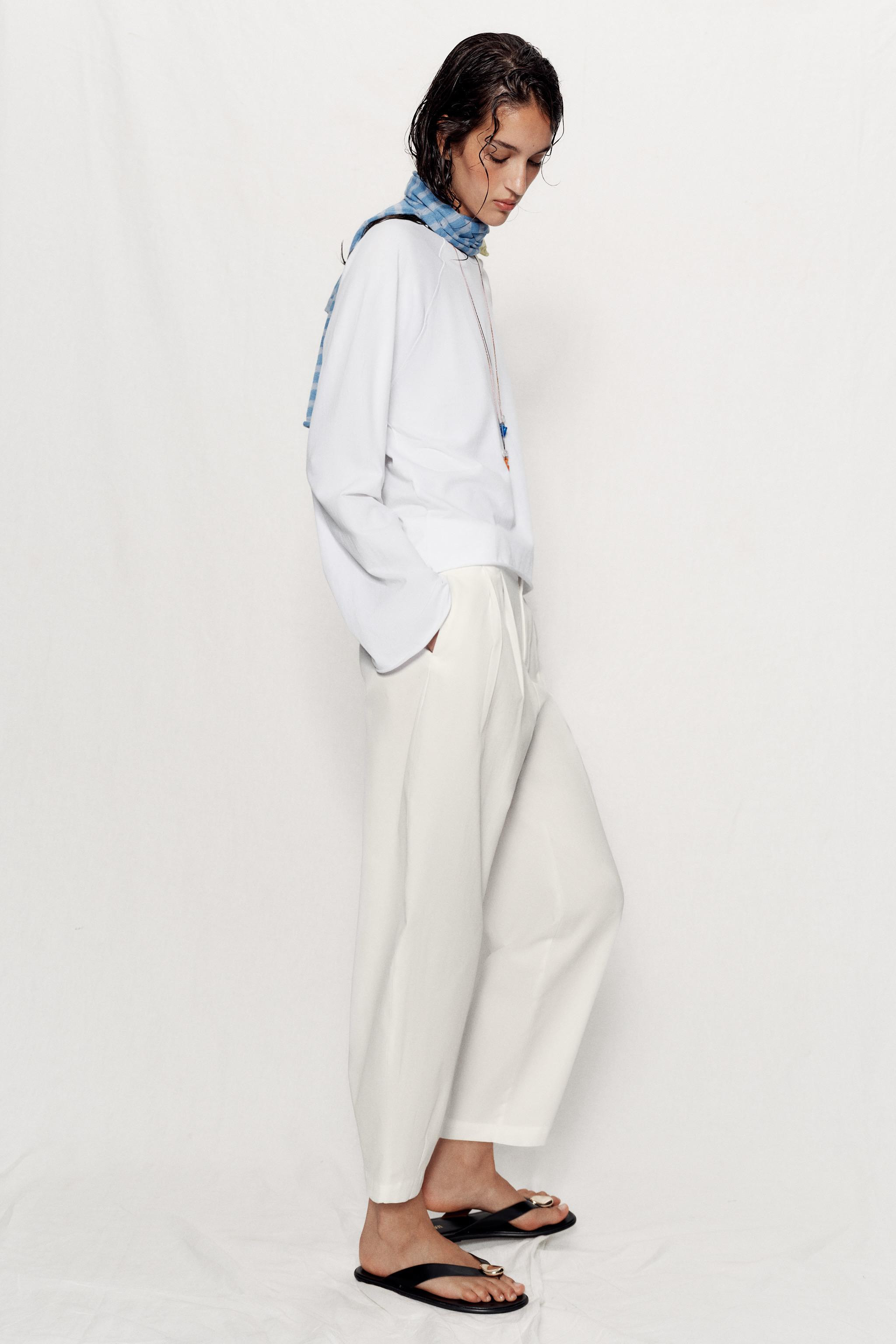 Mid-rise pants with front darts and elasticated back waistband. Front pockets and false back welt... | Zara US
