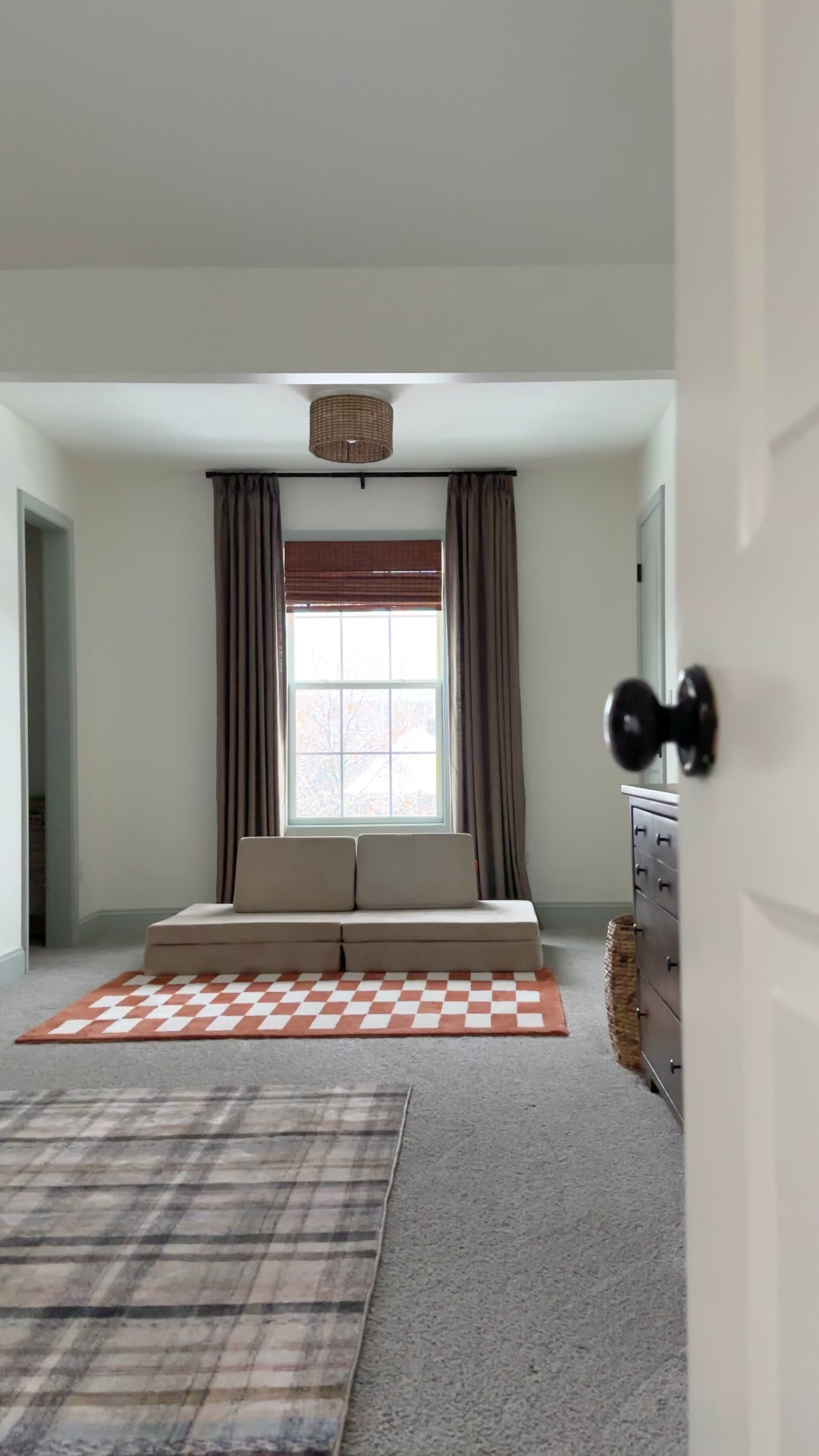 The curtains are by ChadMade: 

The Curtain details: 
*Quantity - 2 panels 
•Tallis Linen Curtain Pinch Pleat
•COLOR — Oak Dim Gray (#908-10)
•Single Panel: Width- 34in, Length- 94in (need 2) 
•Room Darkening 117gsm 
•Memory Trained 

___

Orange Checkered rug is from World Market. 

___

The children’s play couch is by Brentwood Home. It actually has two extra pieces that the Nugget couch does not come with. BUT they are not shown here because I recently purchased a Nugget cover to switch it up from Orange. It works out that the base and triangular pillow measurements are the perfect fit for a Nugget cover too! (Minus the two half-round bolsters not shown) The Brentwood Home couch has been well loved by my boys over the past couple years and has many more years left! Practically brand new with the cover swap.  Nugget just offers more color options for covers. 💃🏼 






Shared boys’ bedroom. Twin Boy Bedroom. Custom Curtains. 



#LTKhome #LTKVideo #LTKkids