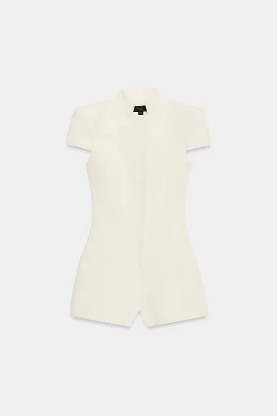 Playsuit with a high neck and short sleeves with shoulder pads. Faux welt pockets at the front. M... | Zara UK