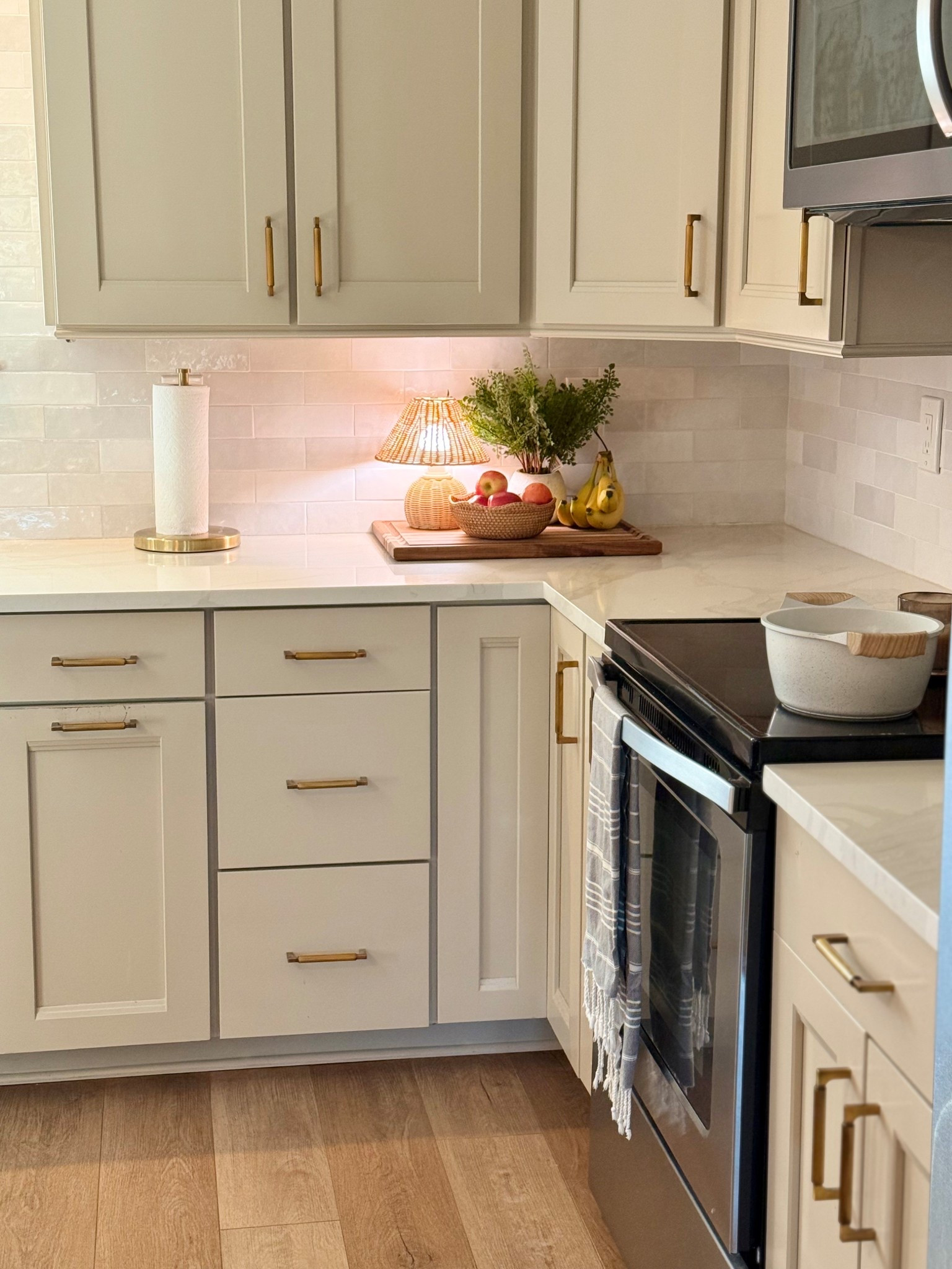 Cozy kitchen (pre-Christmas decor) 
Beige taupe cooking pans pots gold paper towel holder hardware 


#LTKHome #LTKSaleAlert #LTKCyberWeek