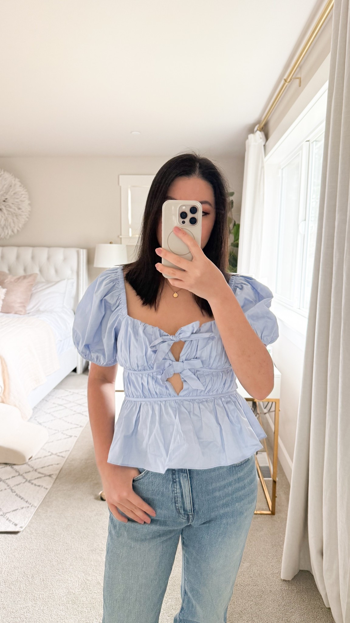 Bow top with puff sleeves ($55) and Madewell straight jeans. Wearing a small on top and size 27 in jeans!

#LTKPetite #LTKStyleTip #LTKFindsUnder100