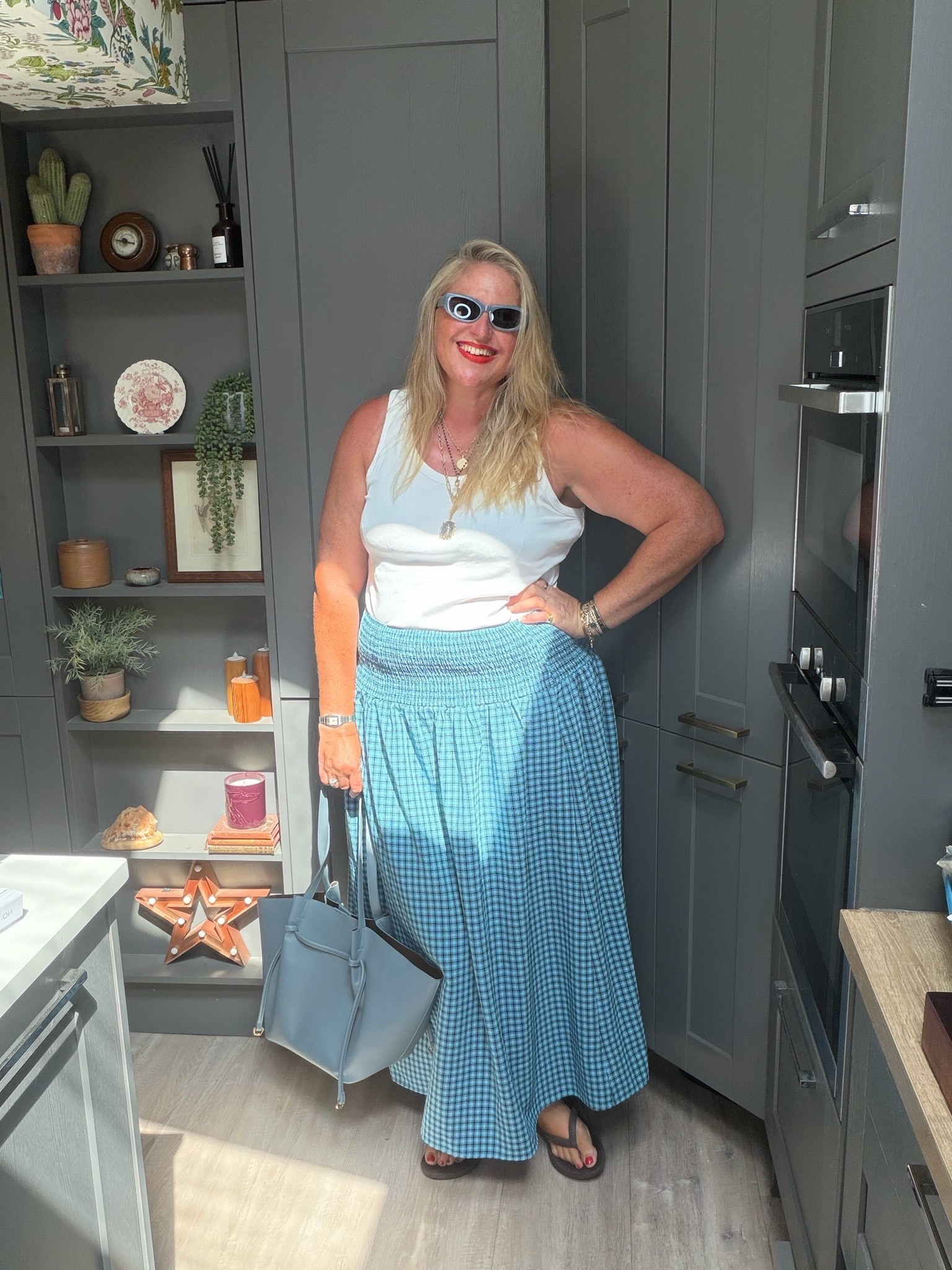 Gingham skirt, white vest, blue tote bag, brown flip flops, blue sunglasses, layered necklace

#LTKsummer #LTKplussize #LTKdresses