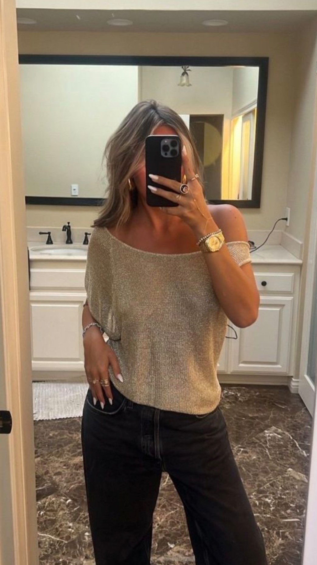 Sparkly gold knit shirt paired with gold watch and low rise black jeans, perfect for elegant style night out :) 🪩💛

#LTKBeauty #LTKValentine #LTKgrwm