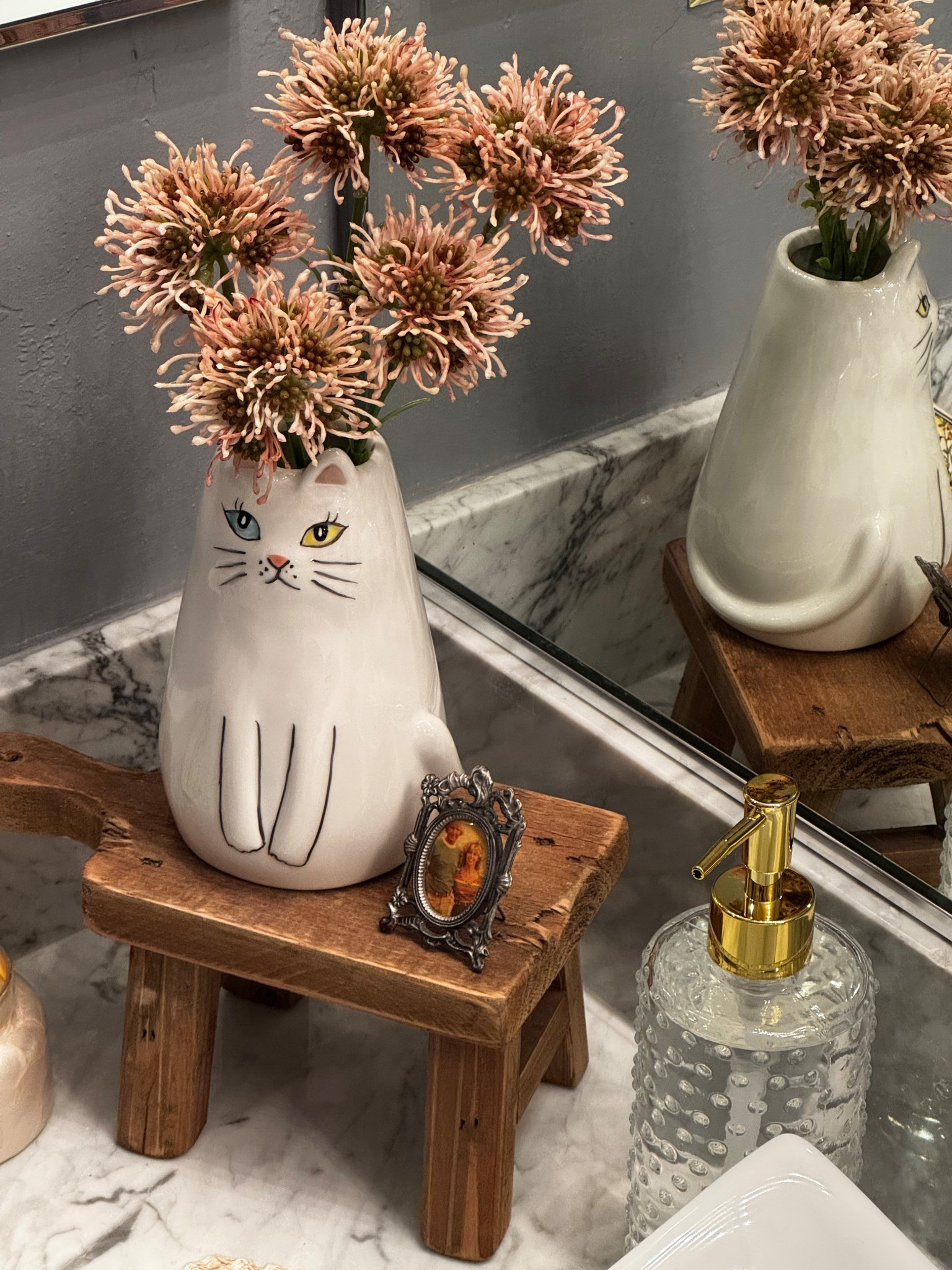 How cute is this cat vase?! I love how she has two different colored eyes and she is so adorable perched atop this small wood pedestal. The perfect gift for all the cat ladies in your life 🐱 🌸

#LTKKids #LTKHome #LTKFindsUnder50