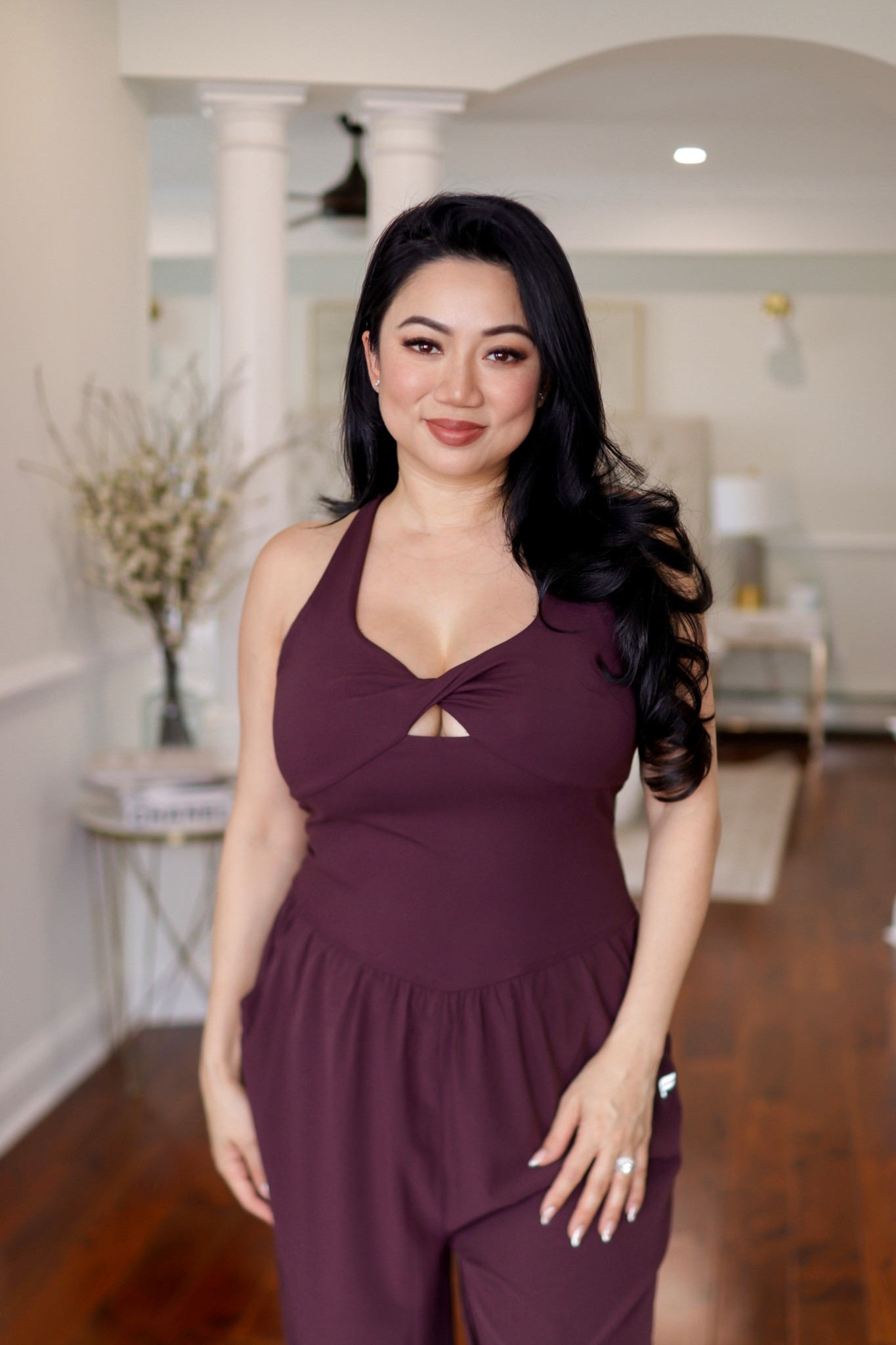 A mixed-fabric jumpsuit designed for ease with a polished touch. The twist-front neckline and keyhole refine the top, while the convertible bungee hem shifts from jogger to wide leg so you feel comfortable and styled all day. I’m wearing a size medium.