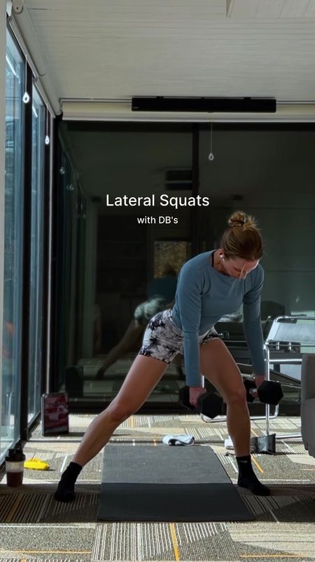 Lateral squats using 2 dumbbells in each hand with arms positioned around the working leg. Can focus on one leg at a time or alternate side to side. Wearing a fitted (but with stretch) teal/steel blue long sleeve (that’s more blue and less muted in person than in the photos on Amazon), a v-waist scrunch butt marble black and white gym short, cross strap sports bra and crew socks. Paired with gym equipment: 15lb dumbbells, Apple AirPods, fabric resistance bands, and a travel yoga mat

#LTKActive #LTKVideo #LTKFitness