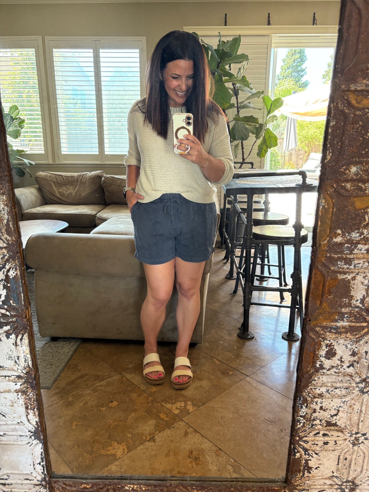 Easy summer sweater and drawstring pull on shorts for a cool, coastal feeling summer day and a bbq and fire pit night! Wearing a small in my shorts and sweater. Also linked my go to two tone earrings set that goes with my Apple Watch band.

#LTKPetite #LTKSummerEdit #LTKOver40
