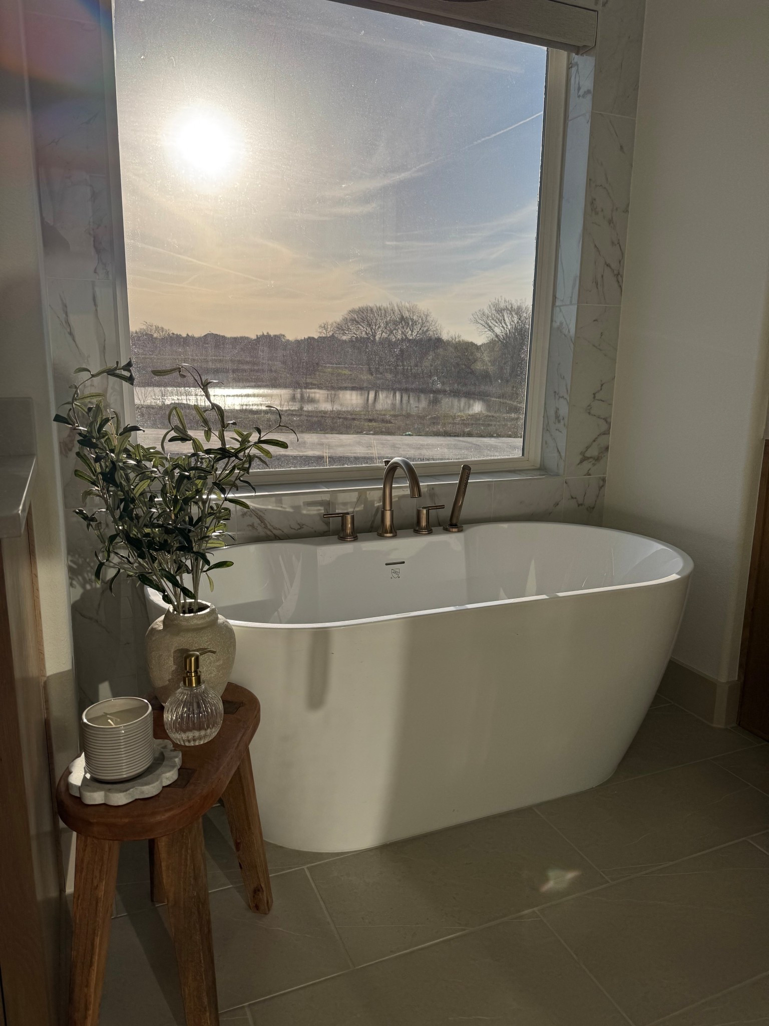 My primary bathroom is a vibe. I’ve never been a bath girly but that is about to change with this set up! #bathstool
#masterbath #bathaccessories

#LTKHome