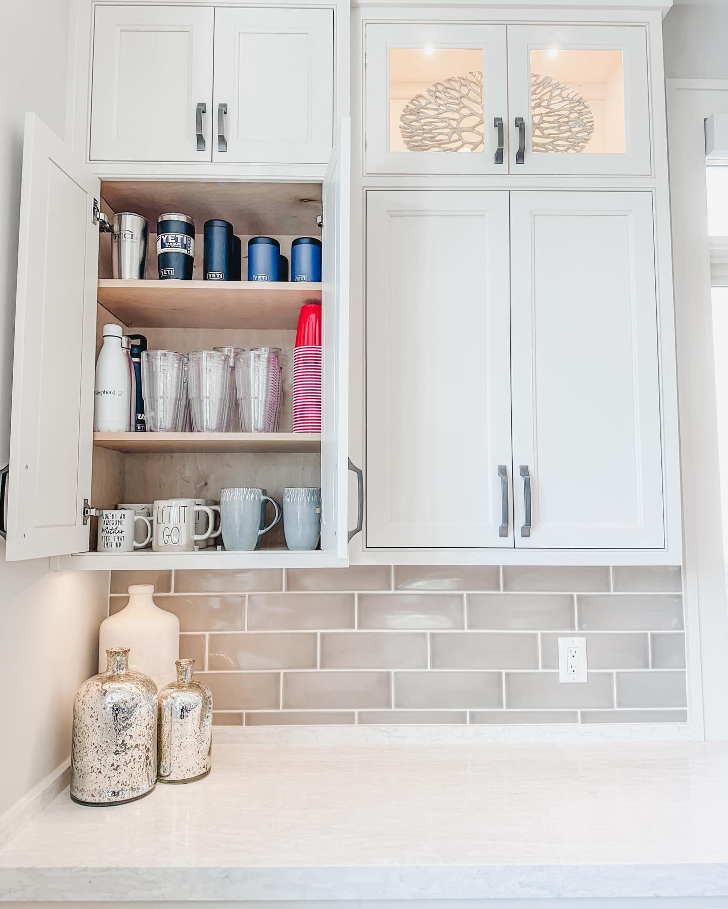These cabinets were in pretty good shape to begin with, but by adding a very luxe set of acrylic shelves (which fit like an absolute glove, I must say), we were able to banish stacking glassware.

By rearranging the contents of each cabinet and doing a light edit of mismatched glassware, order was restored in these cabinets a big way. Best part is, it only took about 15 minutes! 

Cheers to the long holiday weekend, friends!