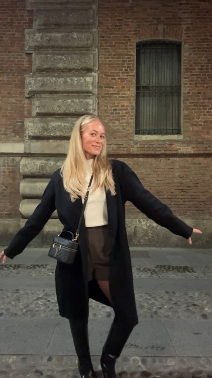 Milan OOTN Fitted ribbedturtleneck layered under an Amazon sweater coat,
@Revolve  boxer shorts with tights, @Reformation  black boots and my little YSL Gaby bag for dinner in the city.

OOTN Milan, Milan night outfit, dinner in Milan outfit, Italy vacation outfit, Europe winter outfit, cozy chic outfit, winter travel outfit, turtleneck styling, shorts with tights outfit, flat boots outfit