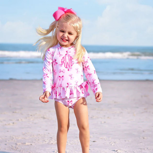 Pink Bow Print Long Sleeve One Piece Rash Guard | Classic Whimsy