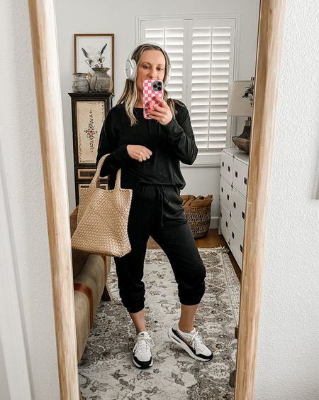 Travel outfit!! Wearing a medium in the lounge set. Love the bag!! Lots of room!!  And the headphones are a must! 

#LTKshoecrush #LTKover40 #LTKmidsize
