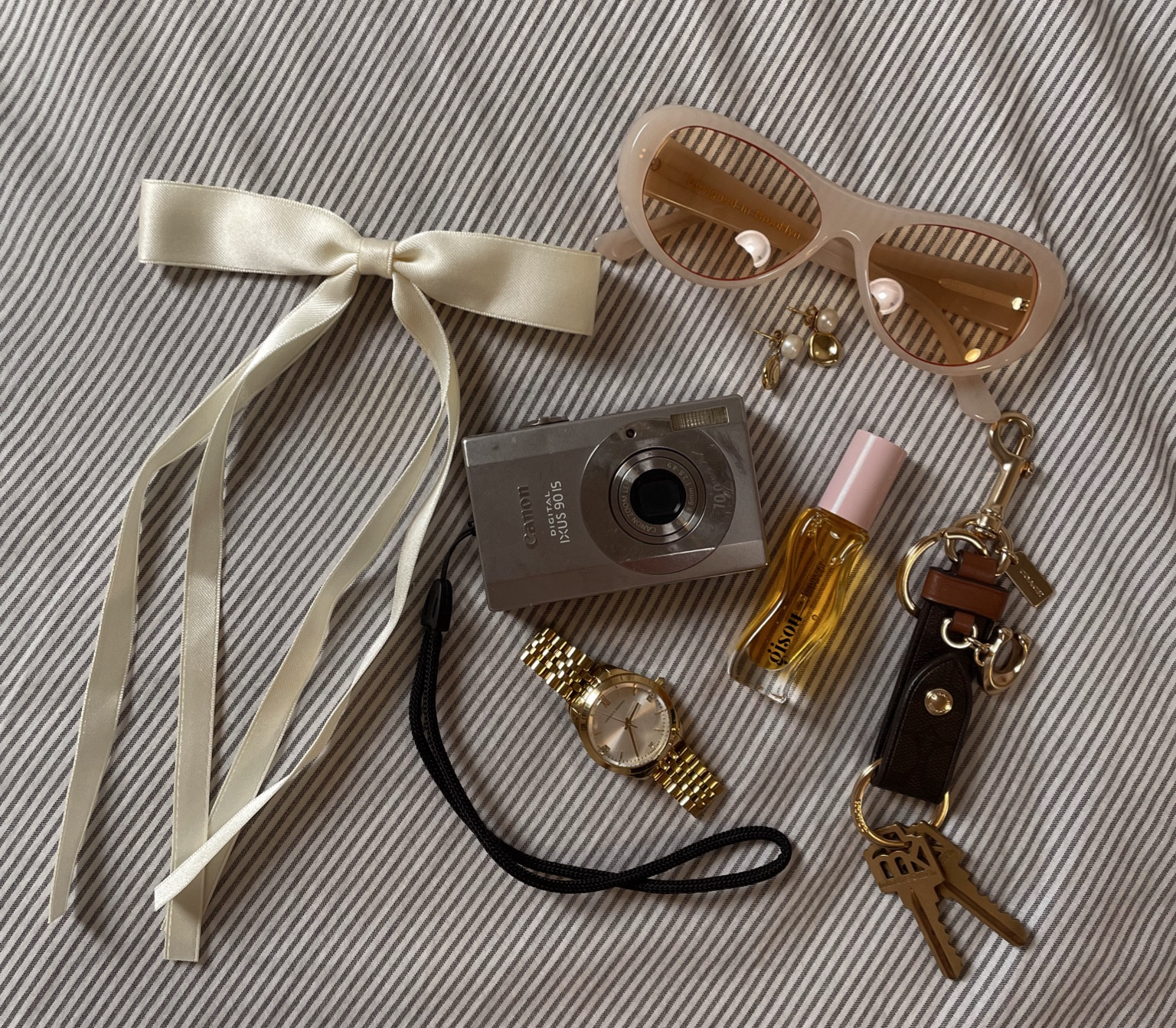 What's in my bag? Sunnies. Gloss. Hair bow. Accessories  

#LTKbeauty #LTKfindsunder50 #LTKMostLoved