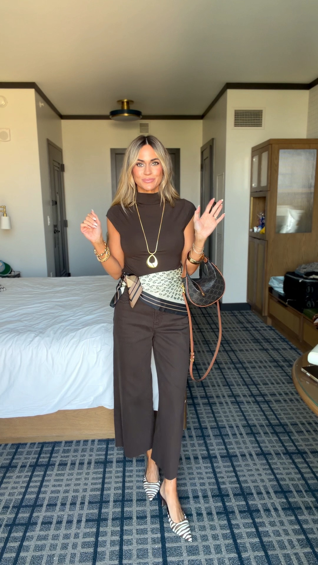 My ootd - love this tone on tone outfit for fall!

Wide leg cropped jeans in chocolate brown  (0 short) - with mock neck cap sleeve top (xs) and the cutest zebra print heels

#LTKCon #LTKOver40 #LTKPetite