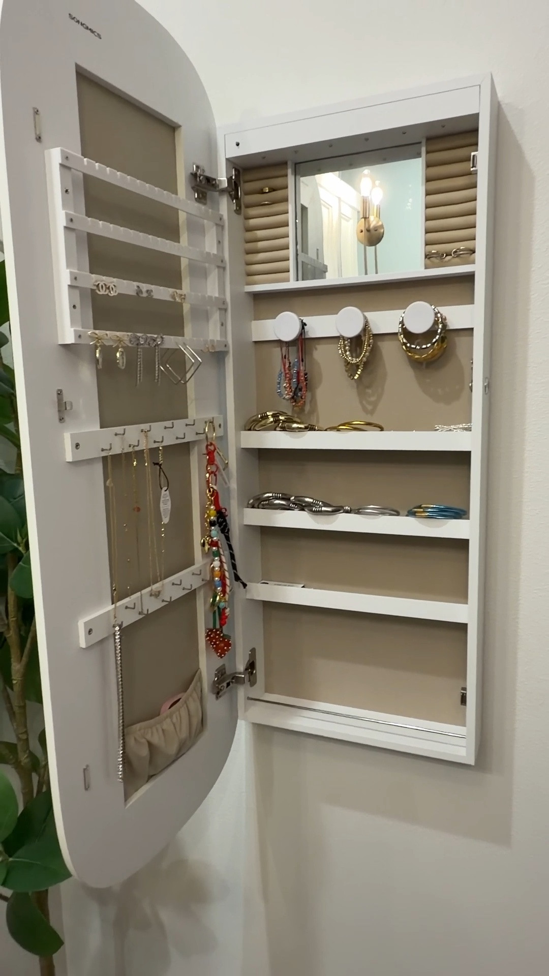 Got preslee this mirror that opens up to a jewelry and perfume organizer. It comes with keys so you can also lock it.